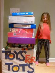 Miranda donates her presents to Toys for Tots